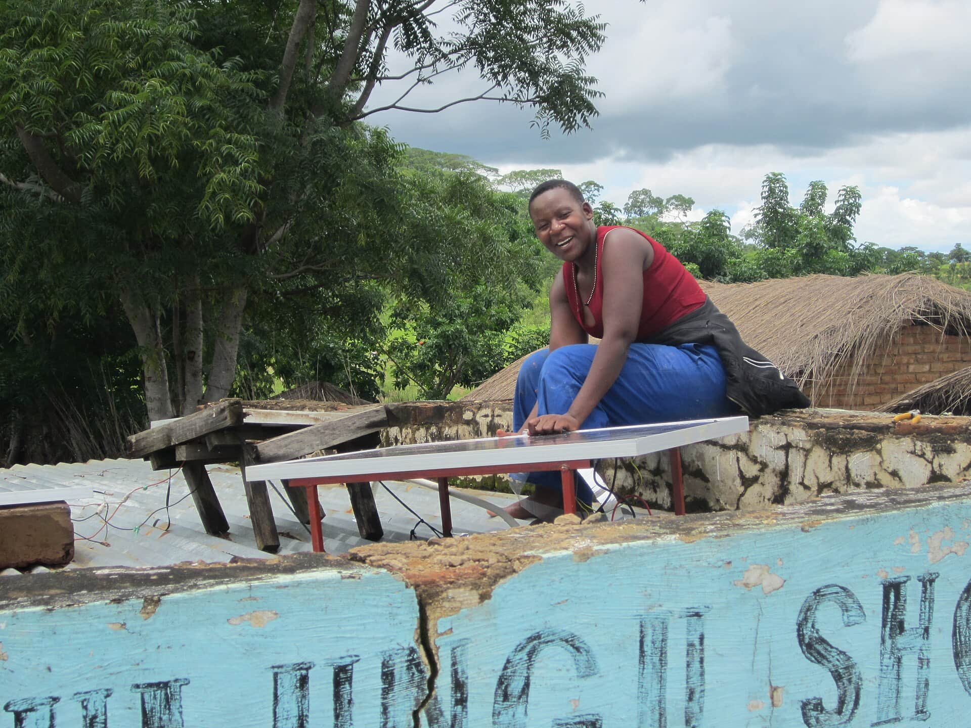 Mounting a solar panel, Masewe, Malawi