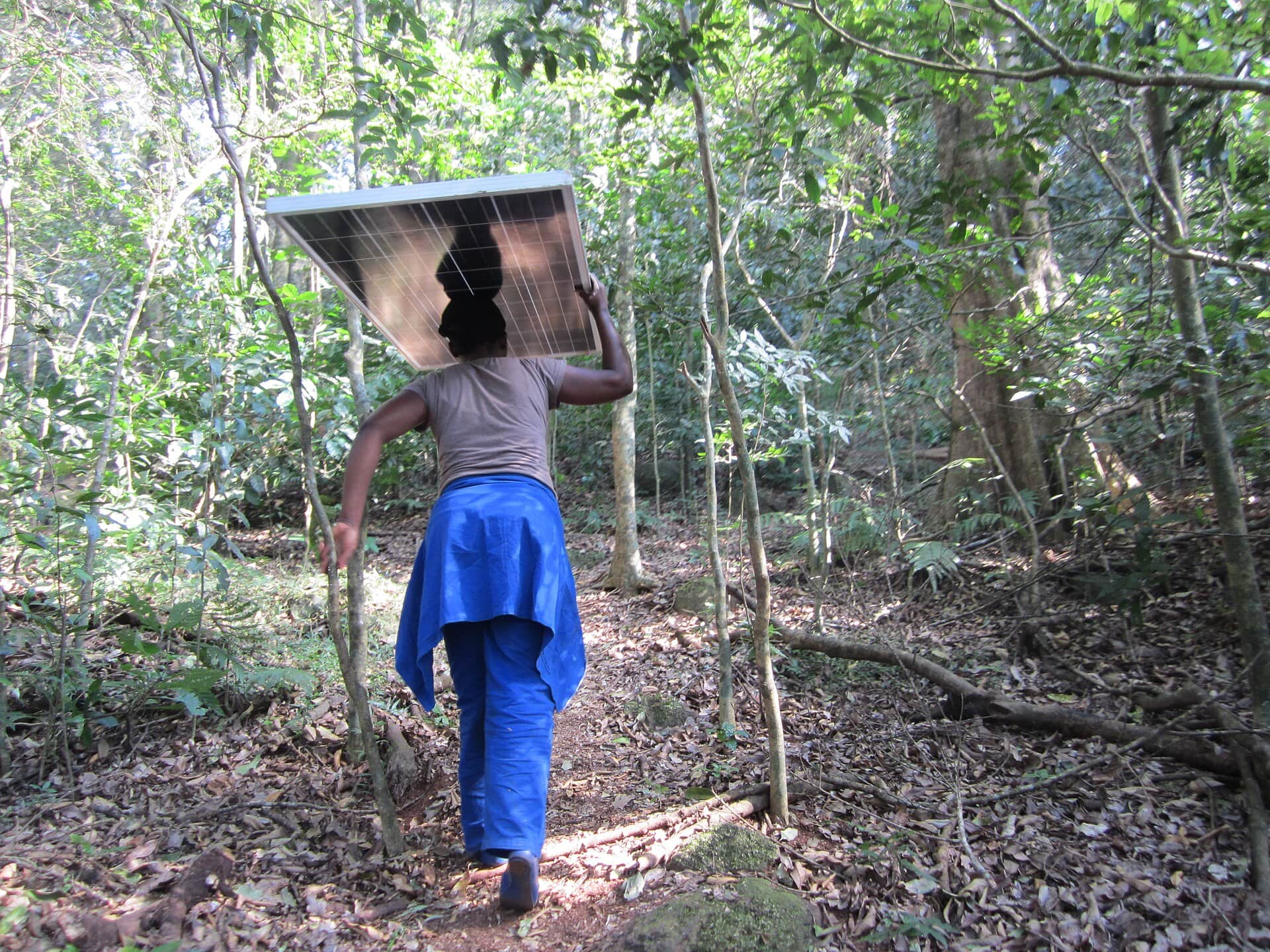 Carrying a solar panel, Malawi